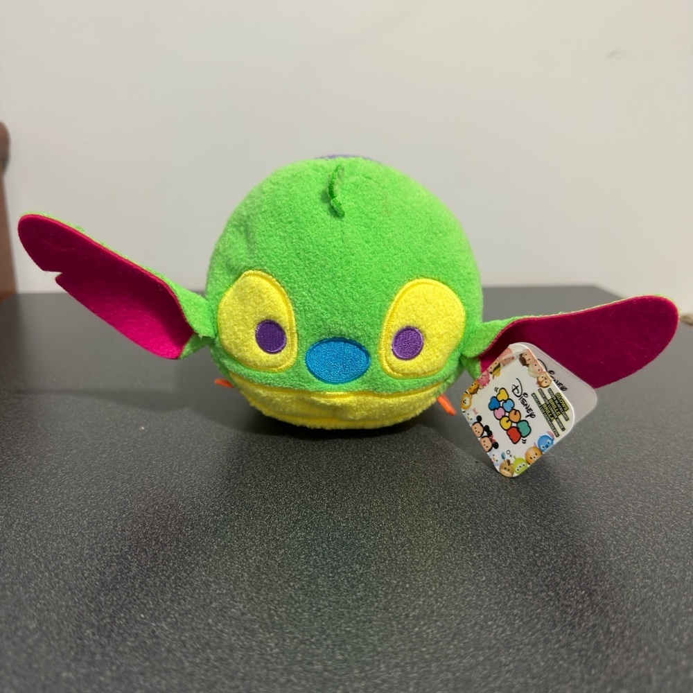 Colorful Plush Toy with Green and Pink Accents